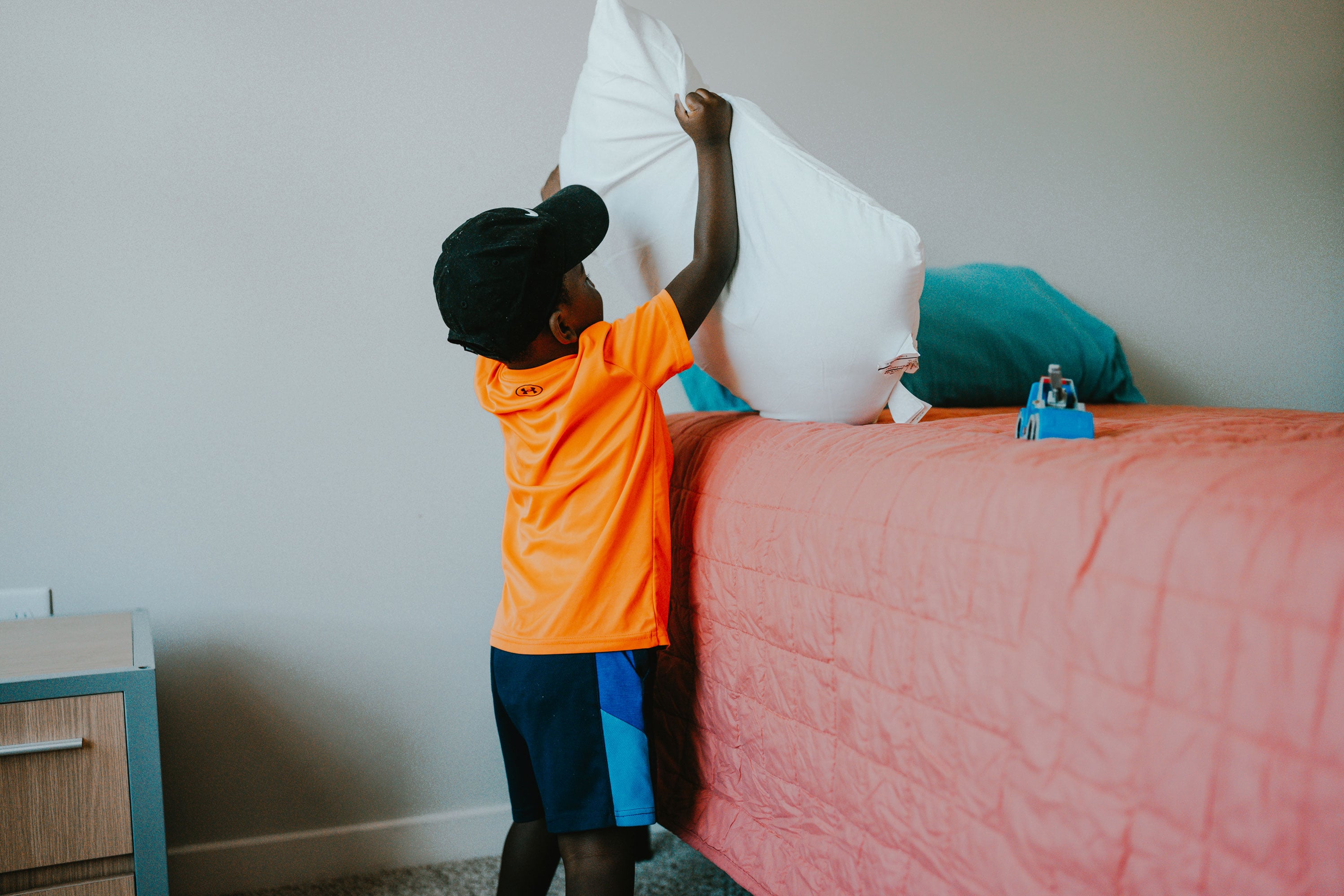 Child making his new bed